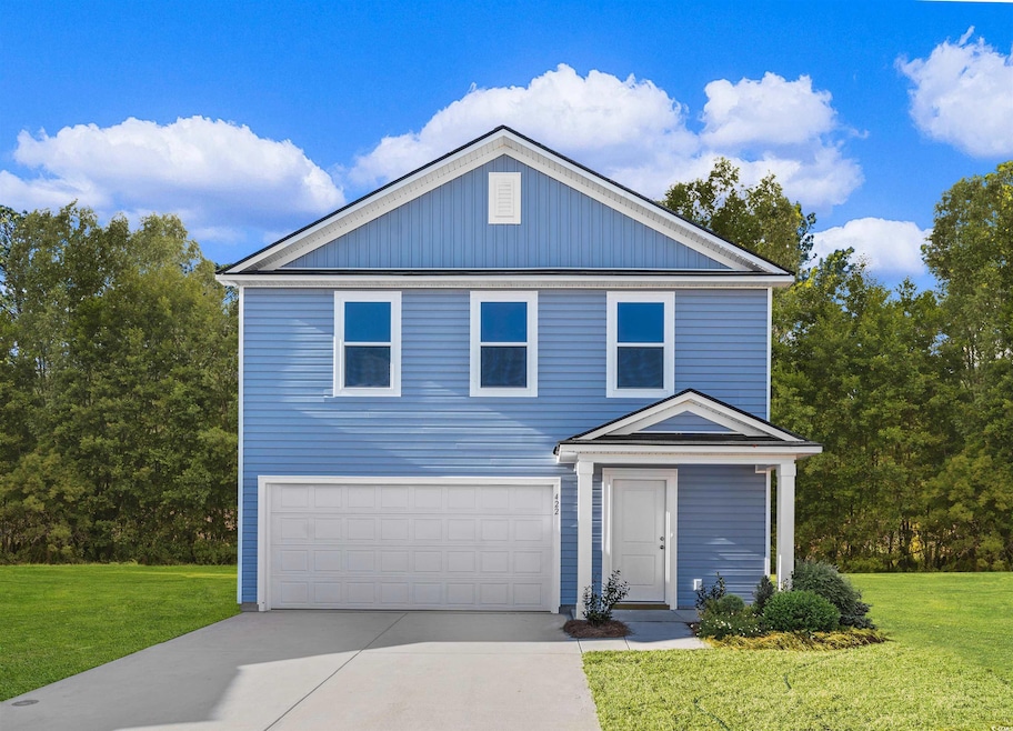 View of front of property featuring concrete driveway, board and batten siding, a garage, and a front yard
