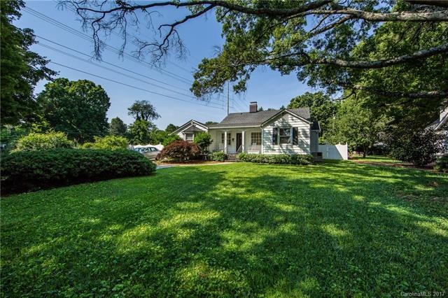 This charming cottage is on large lot with mature 
