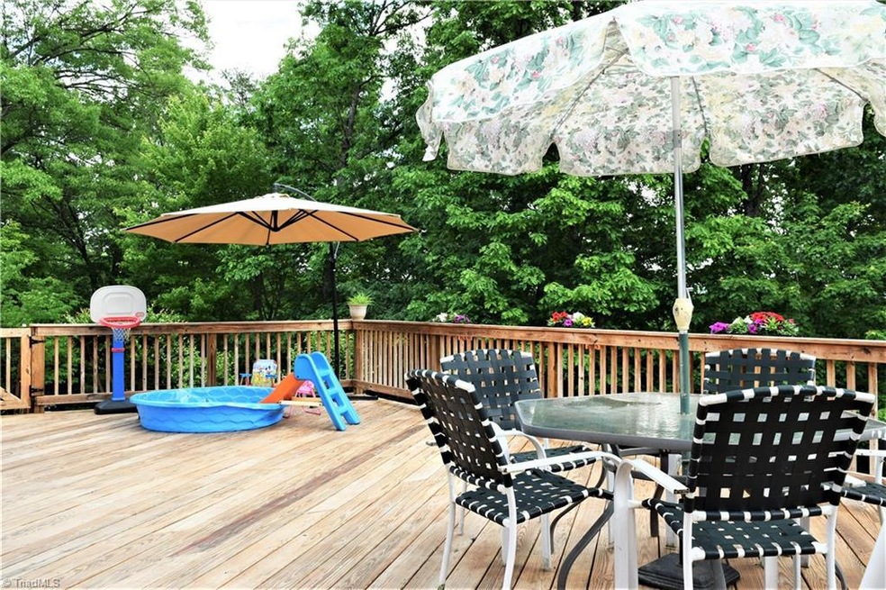 Huge Deck with Access on Both Sides.  Even has Abundant  Storage Underneath (gravel)