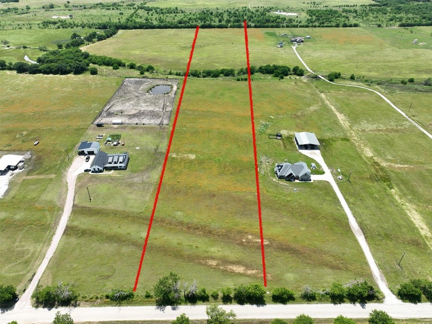 Birds eye view of property with a rural view