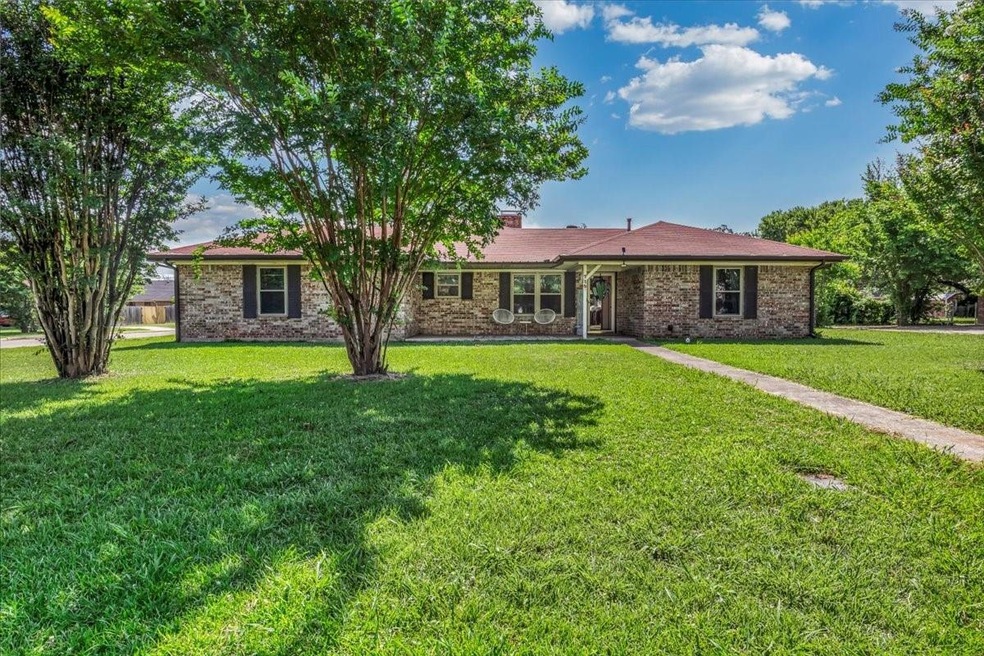 Single story home featuring a front yard
