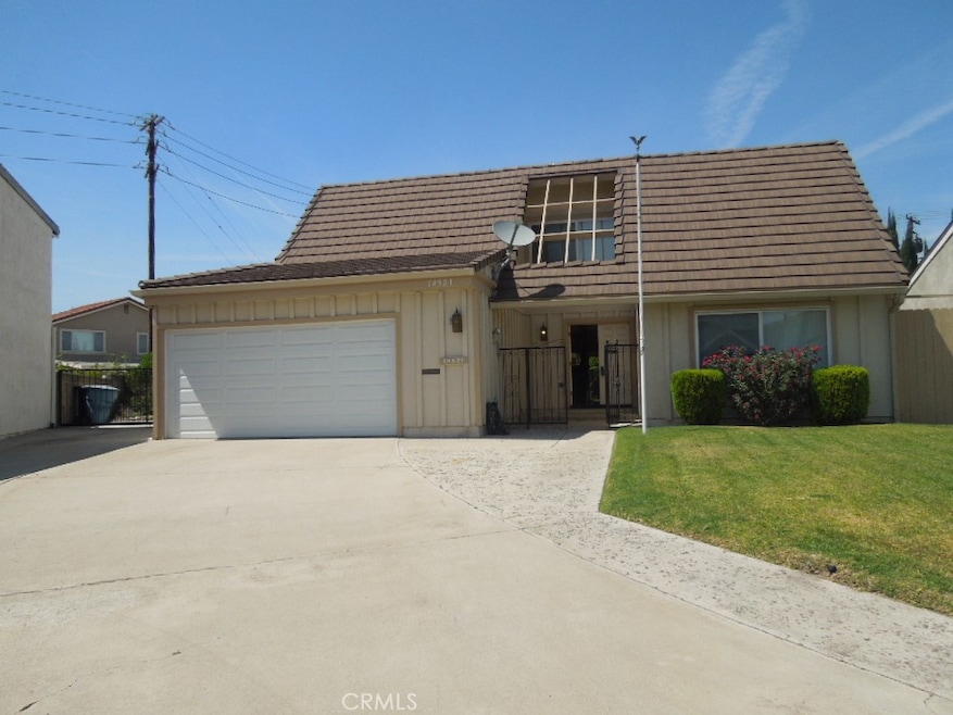 Front of home. Double door entry. Possible RV storage to left of garage.