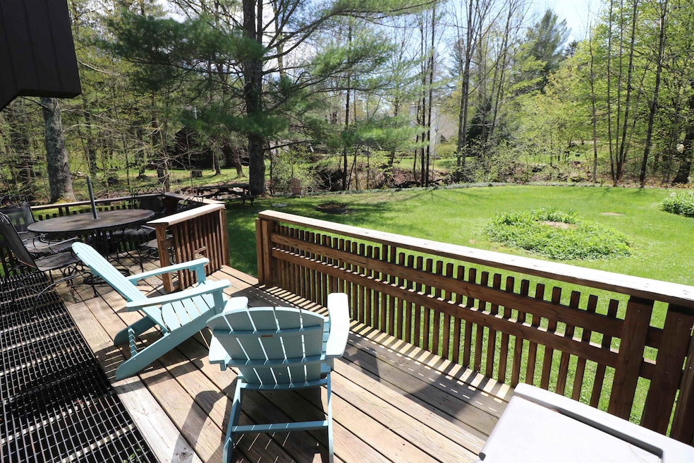 Deck overlooks yard & brook