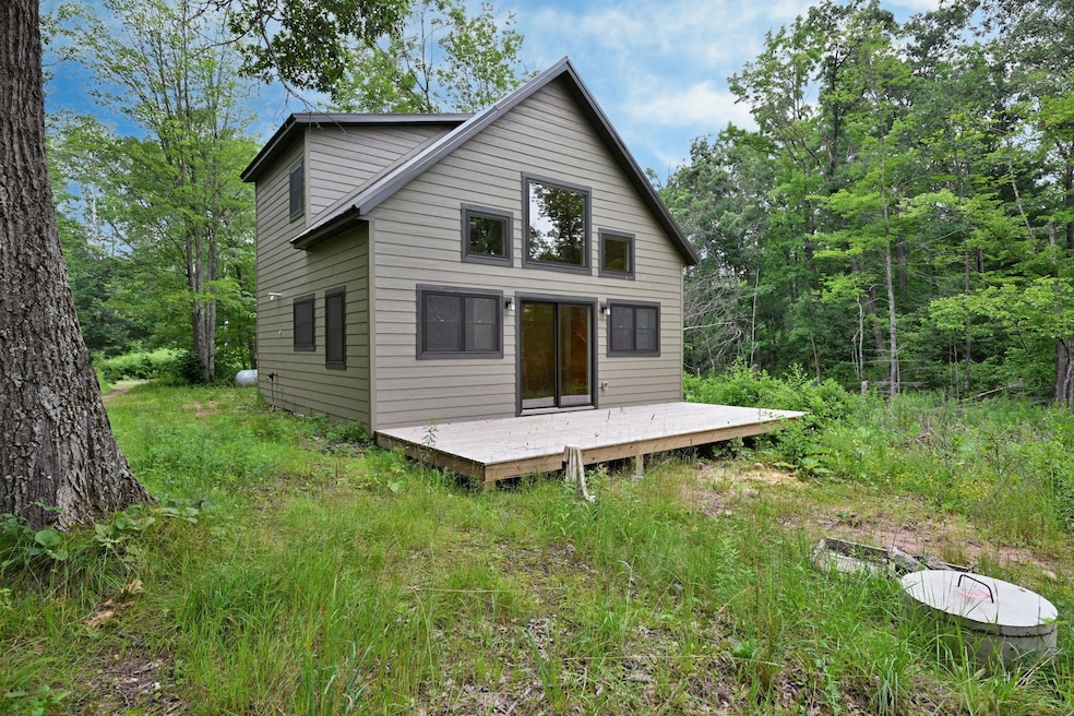 Completed in 2025, this 2-bed, 2-bath lakefront cabin offers classic “Up North” charm with all the perks of new construction.