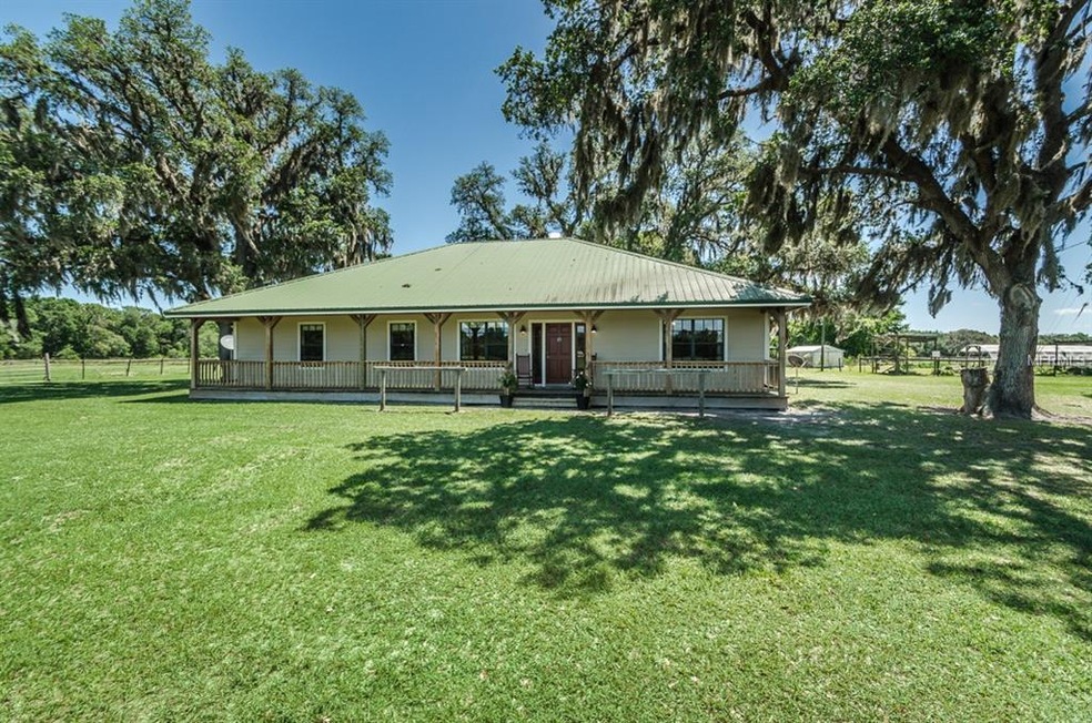 Front of house with full length porch