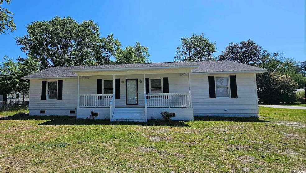 View of front of property featuring crawl space, covered porch, a front lawn, and a shingled roof