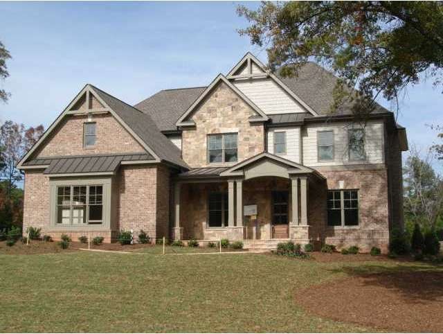 Exterior Front. Beautiful Brick and Natural Stone