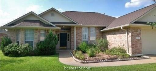 View of front of home featuring brick siding, a fr