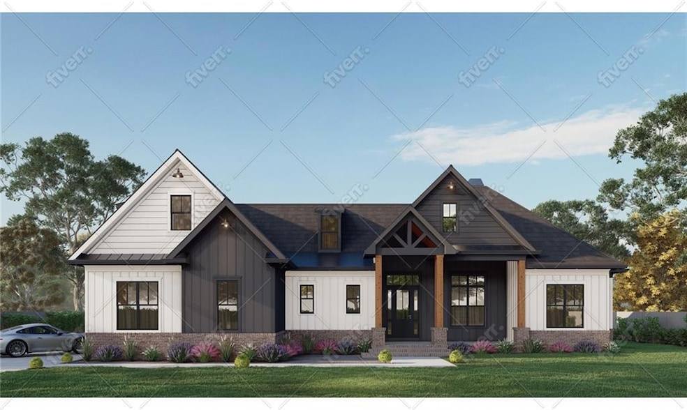 Modern farmhouse featuring board and batten siding, brick siding, a front yard, and a shingled roof