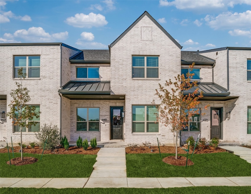 front of 4417 Cave Springs, with a beautiful Half glass front door, brick and large windows.