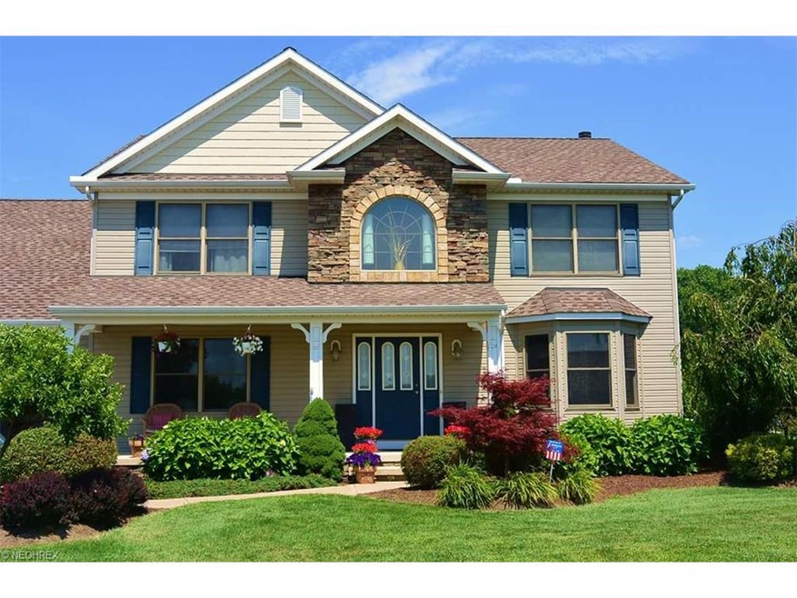 Professional Landscaping Surrounds Home