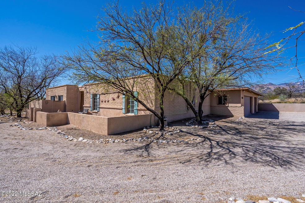 Corner lot with large circular driveway.