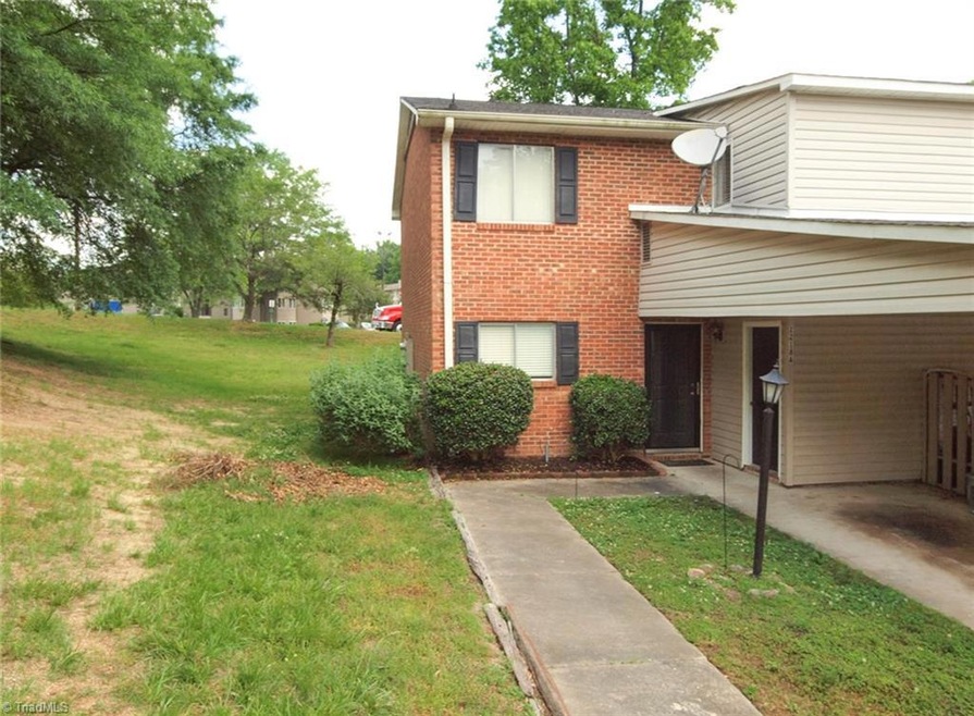 End unit with carport and storage room