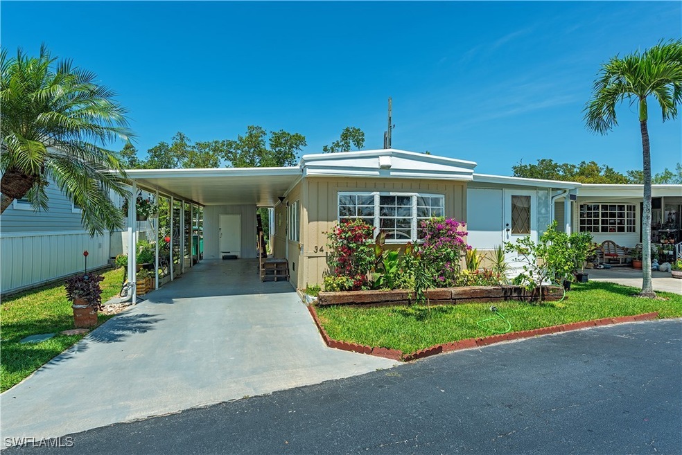 Manufactured / mobile home featuring driveway and