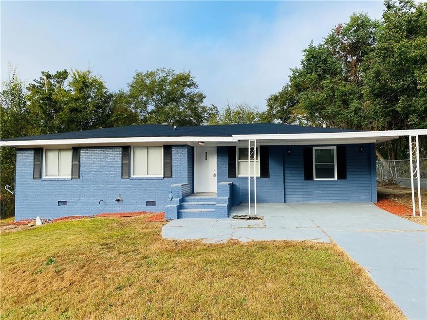 Ranch-style house featuring crawl space, driveway, a front yard, and brick siding