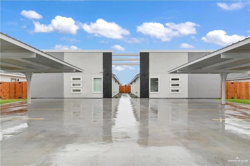 View of side of property with covered parking and stucco siding