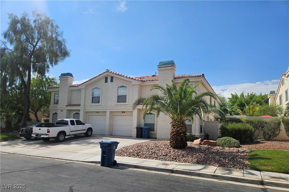 Mediterranean / spanish home with a chimney, a gar
