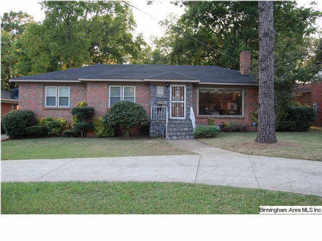 Four- sided brick home with stone enterance and ci