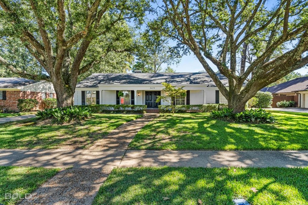 Exterior Front with beautiful trees framing the ho