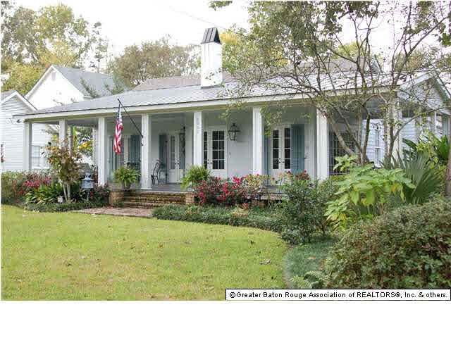 Front right view of home with large wrap around po