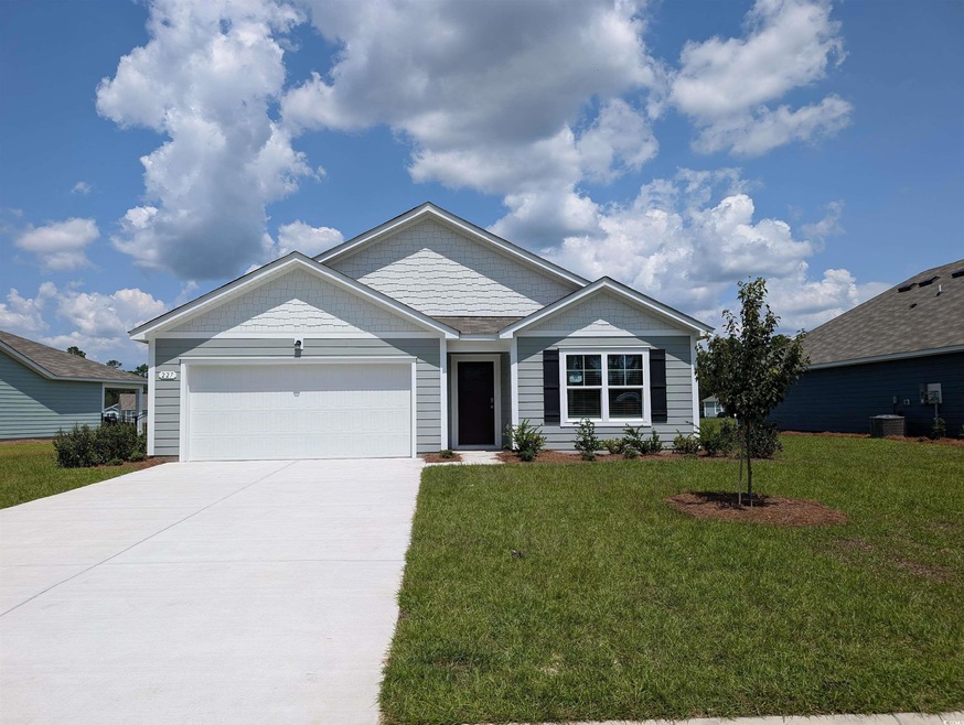 View of front facade featuring a garage and a fron