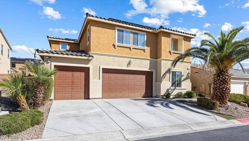 Front of House. Mediterranean style. 3 car garage.