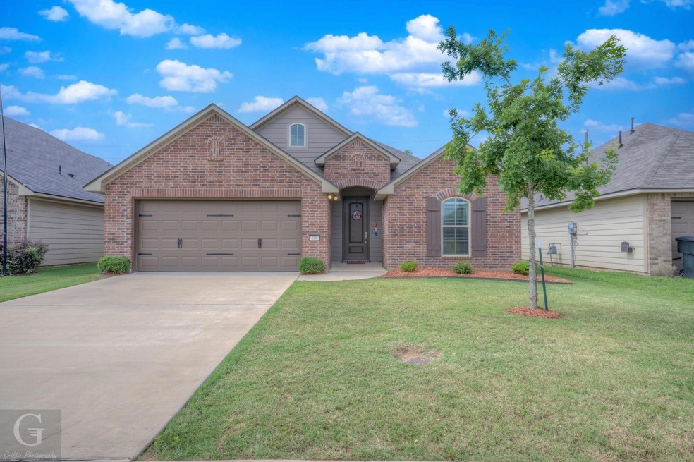 View of front of property with a front lawn and a 