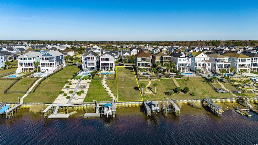 Birds eye view of property with a residential view and a water view
