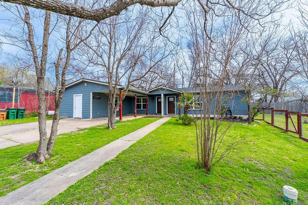 View of front of property featuring driveway, fen