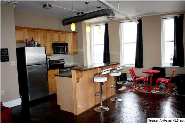 LIGHT Floods the kitchen and Living area.