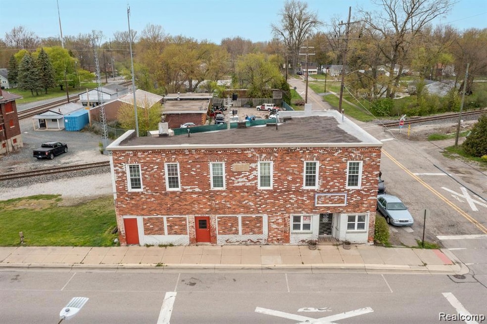 Front of Building (3 apartments upstairs, 1 large commercial space on first floor)