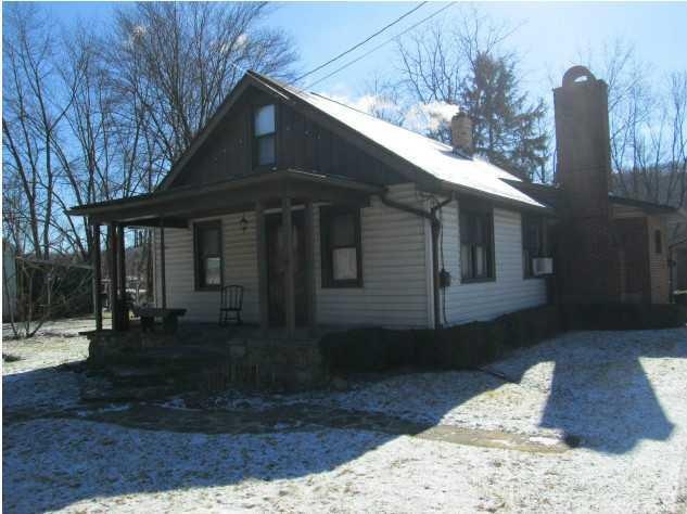 Exterior Front. Cozy and Warm! Stone front porch.