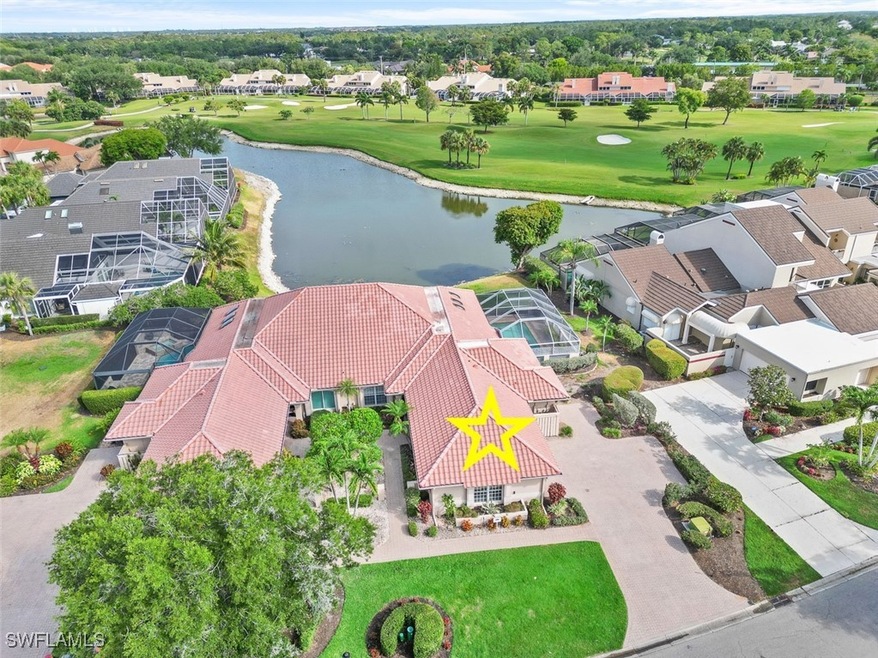 Aerial perspective of suburban area with a golf cl