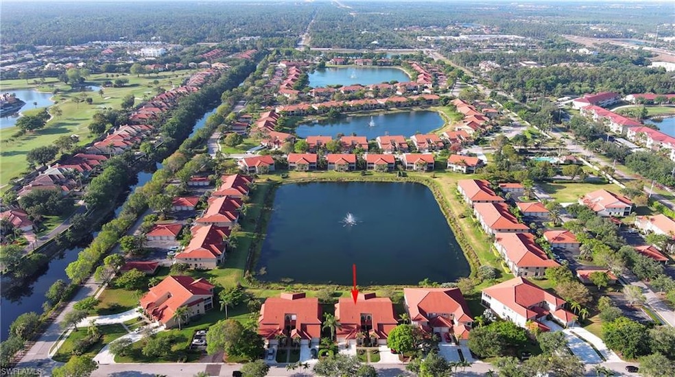 Aerial view with a residential view and a water vi