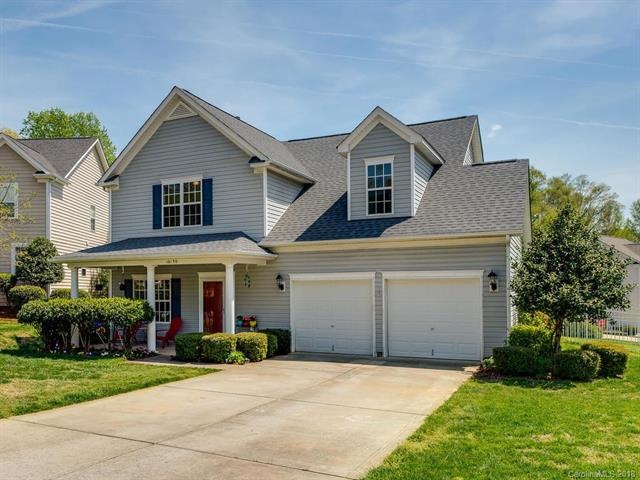 Front elevation w/ large driveway