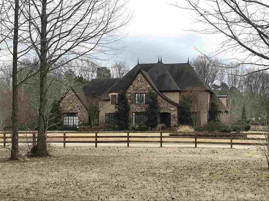 Front Elevation taken from beautiful neighborhood 