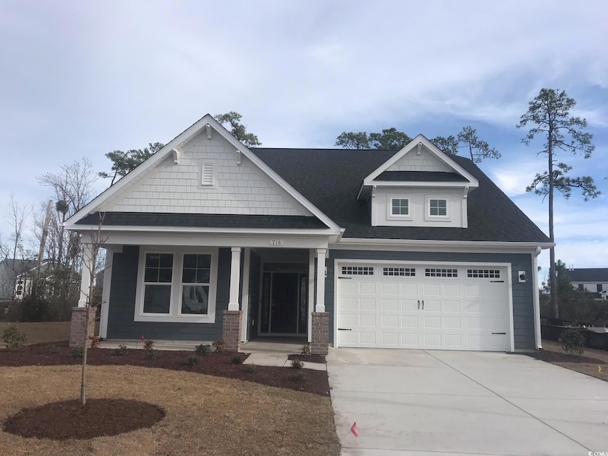 Craftsman house featuring a garage