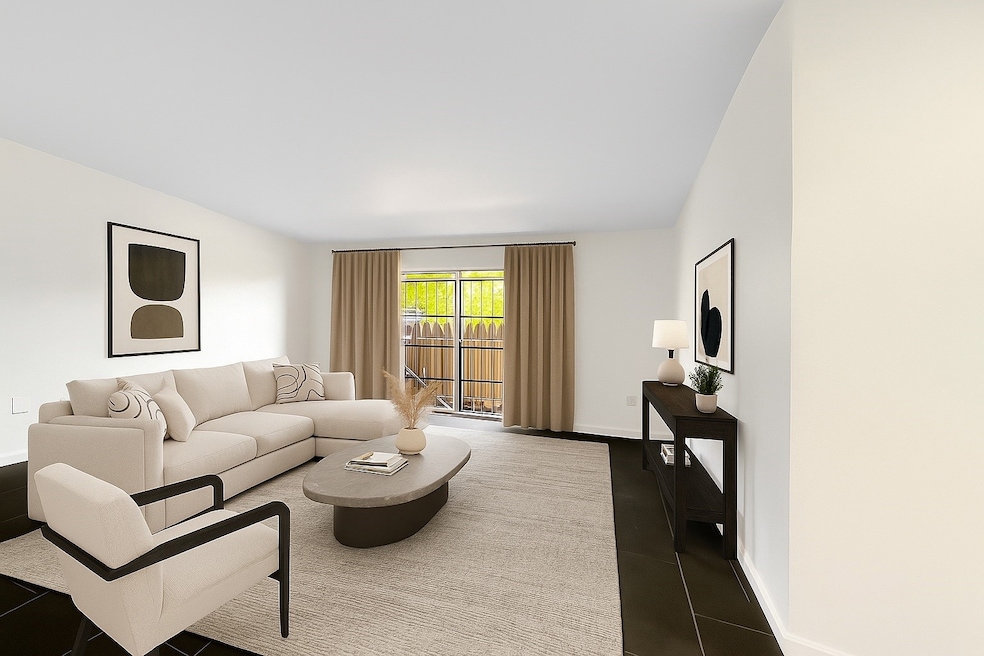 Spacious living room featuring brand new tile floo