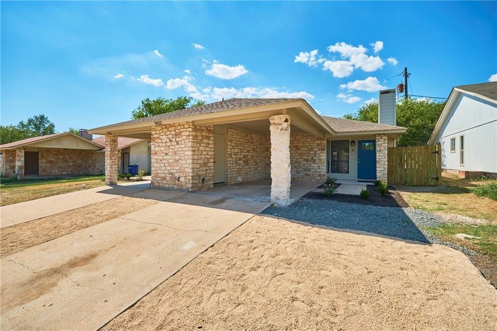 View of front of house with concrete driveway and