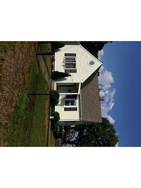 Exterior Front. UPDATED VINYL SIDING,ROOF, AND WIN