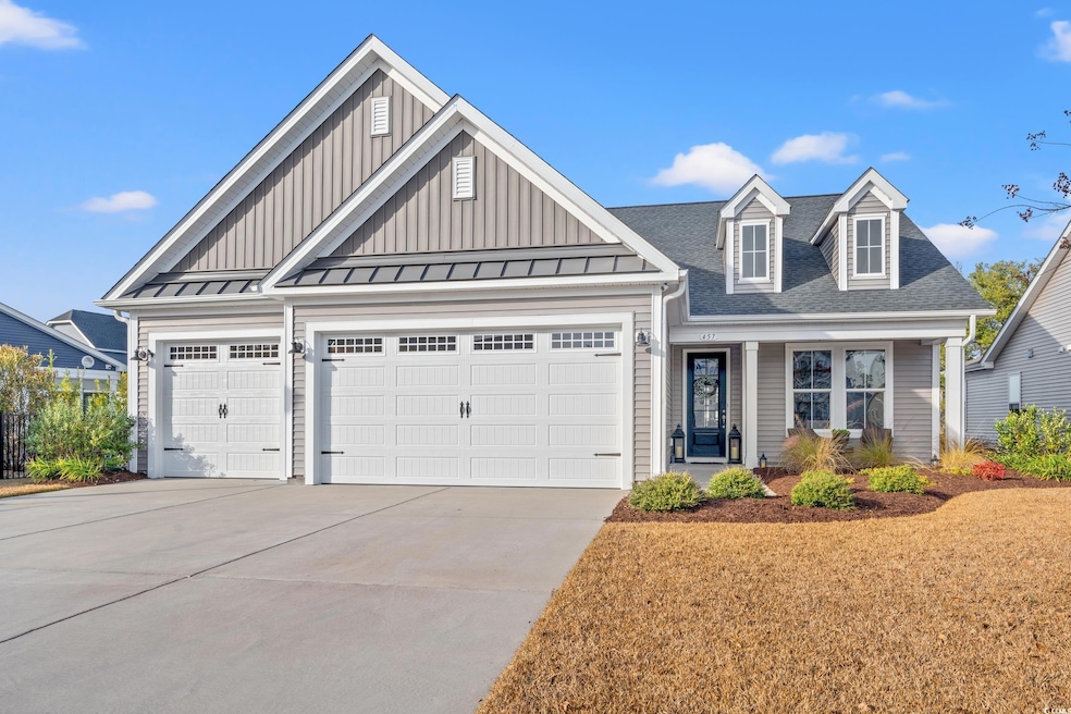 View of front facade featuring a garage