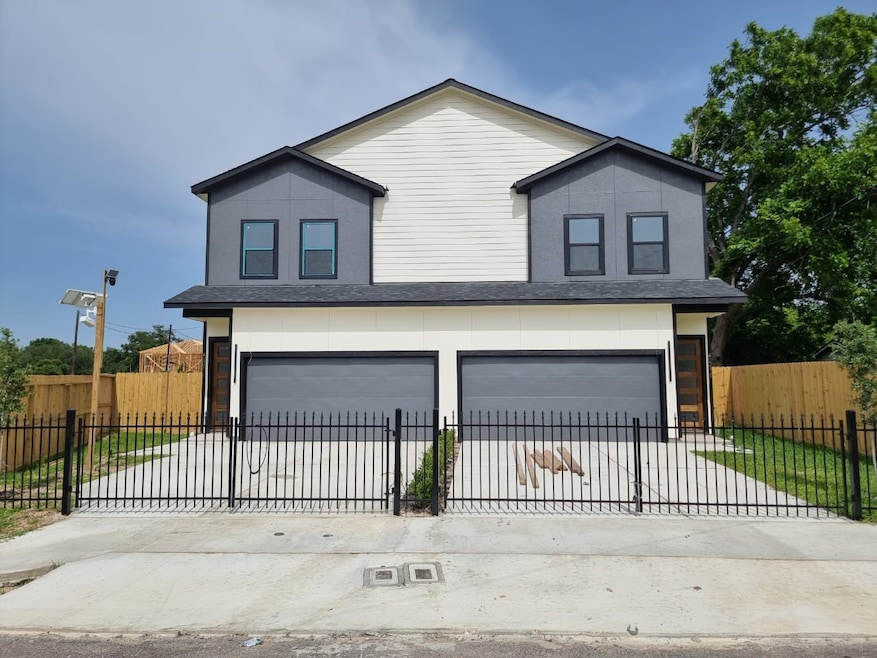 The front view of the duplex with a two-story desi