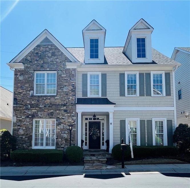 Beautiful home featuring Stacked-stone, Shake and 