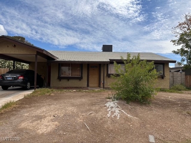 Single story home featuring fence, driveway, and a