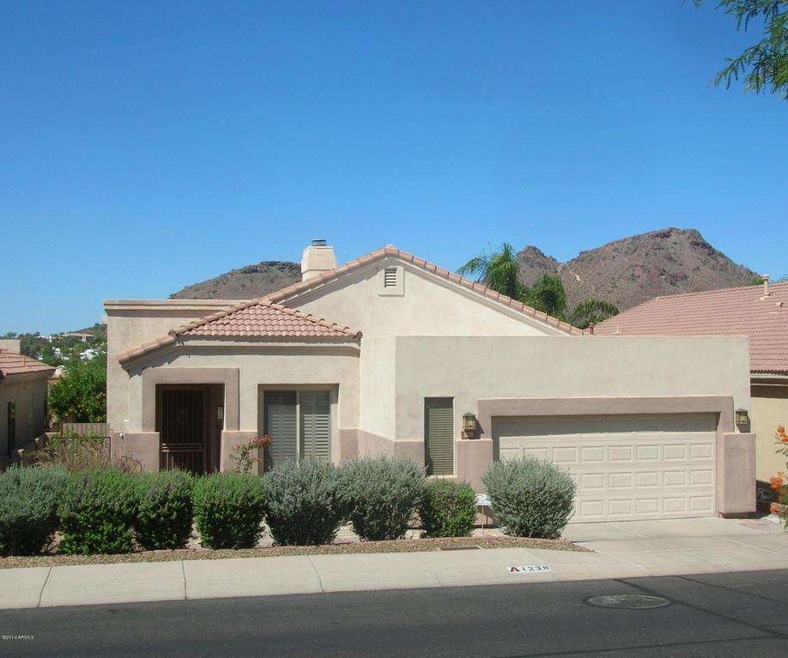 FRONT VIEW OF HOME & MOUNTAINS BEHIND
