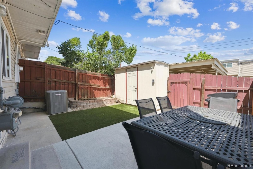 Fully enclosed back yard/patio with shed
