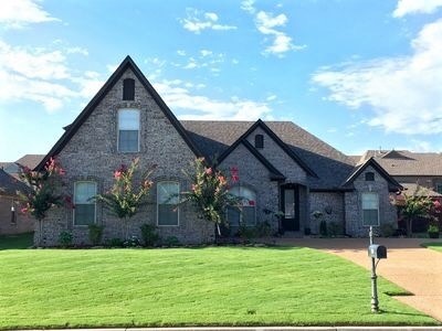 This home enjoys a 2-car side load garage plus add