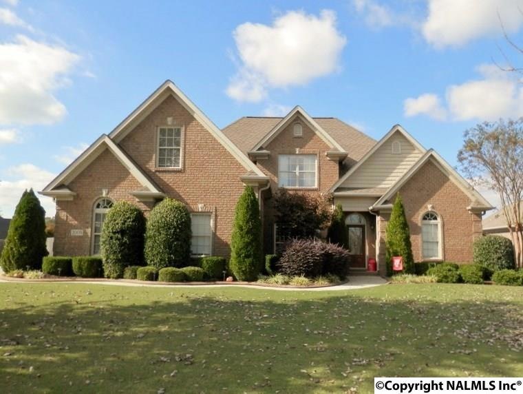 Beautifully landscaped yard welcomes you home.