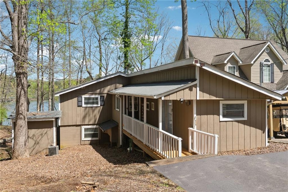 Chalet / cabin featuring roof with shingles and a 