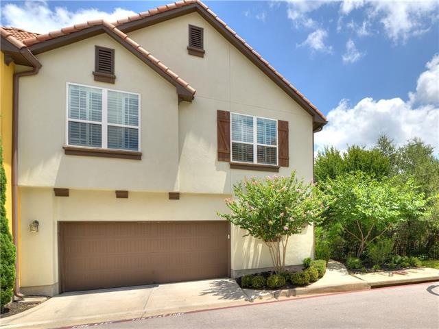 European flair stucco 2 story condo with red tile 